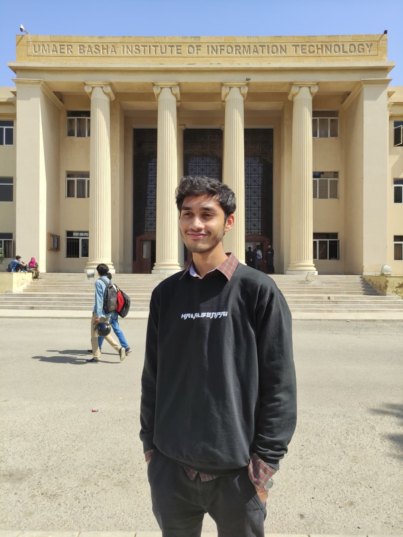 Portrait of Abdullah Chaghtai standing outside UBIT in Karachi.